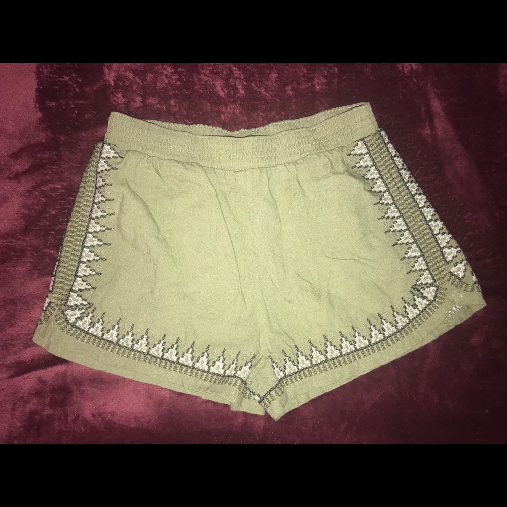 Green shorts with design on the outer lining